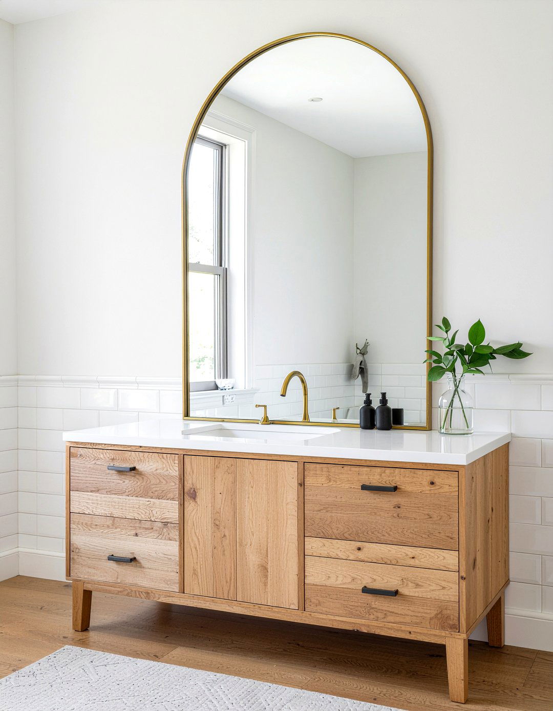 Arched gold vanity mirror - 30 partial bathroom remodel ideas