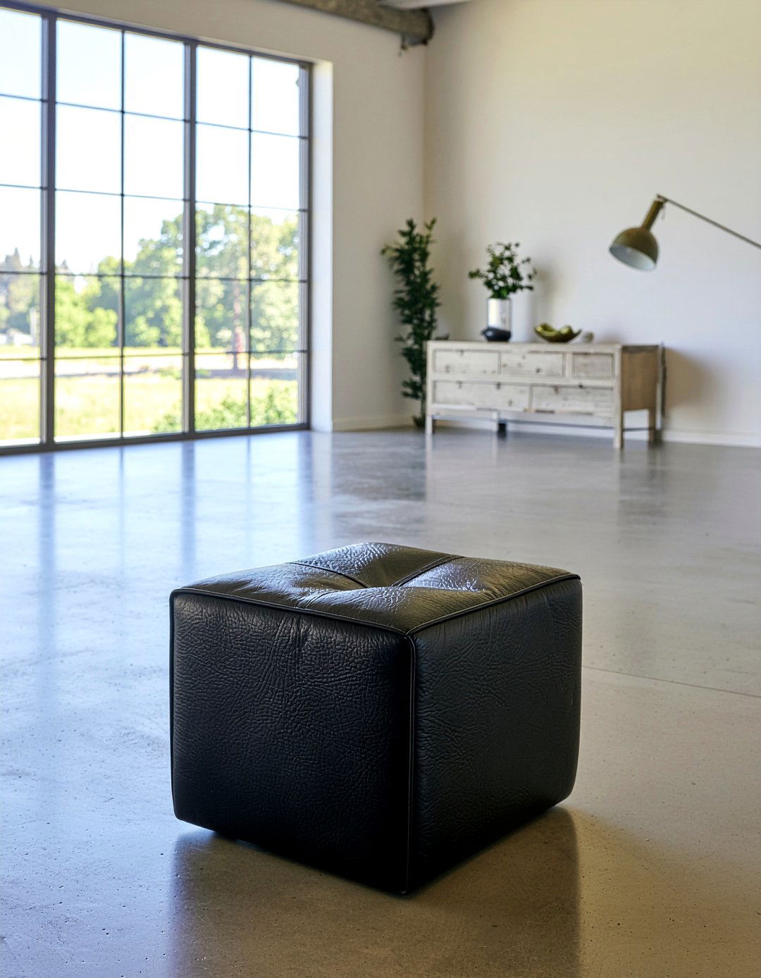 Black Leather Pouf - 30 living room pouf ideas