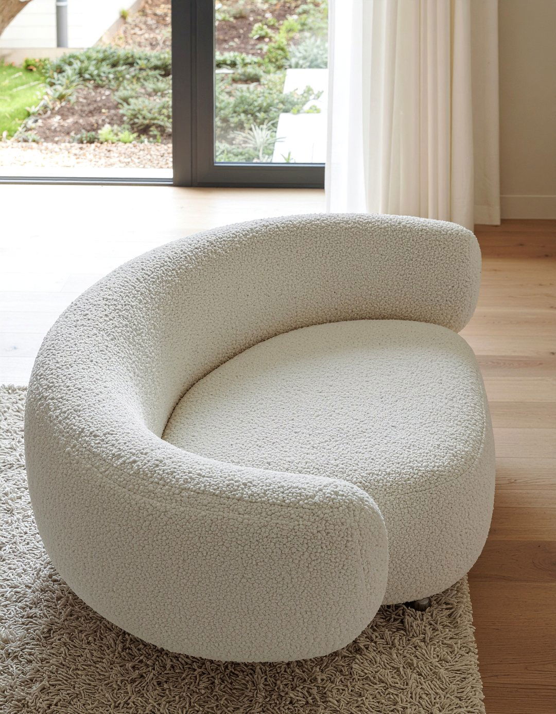 Curved Boucle Sofa - 30 living room maximalist furniture ideas