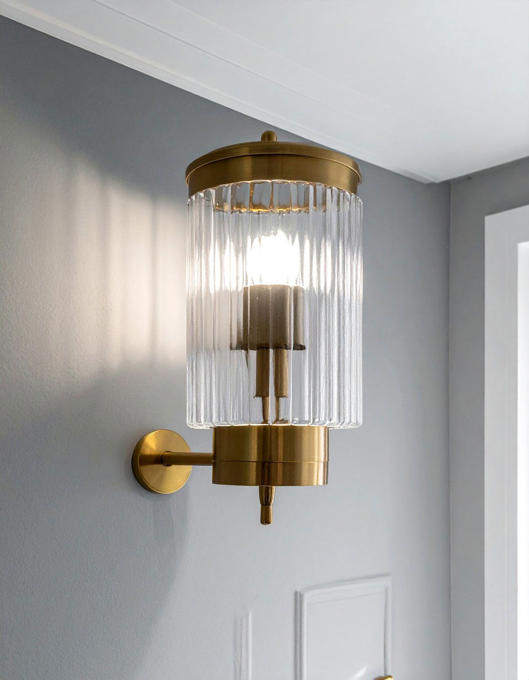 Fluted glass wall light - 30 bathroom sconce ideas