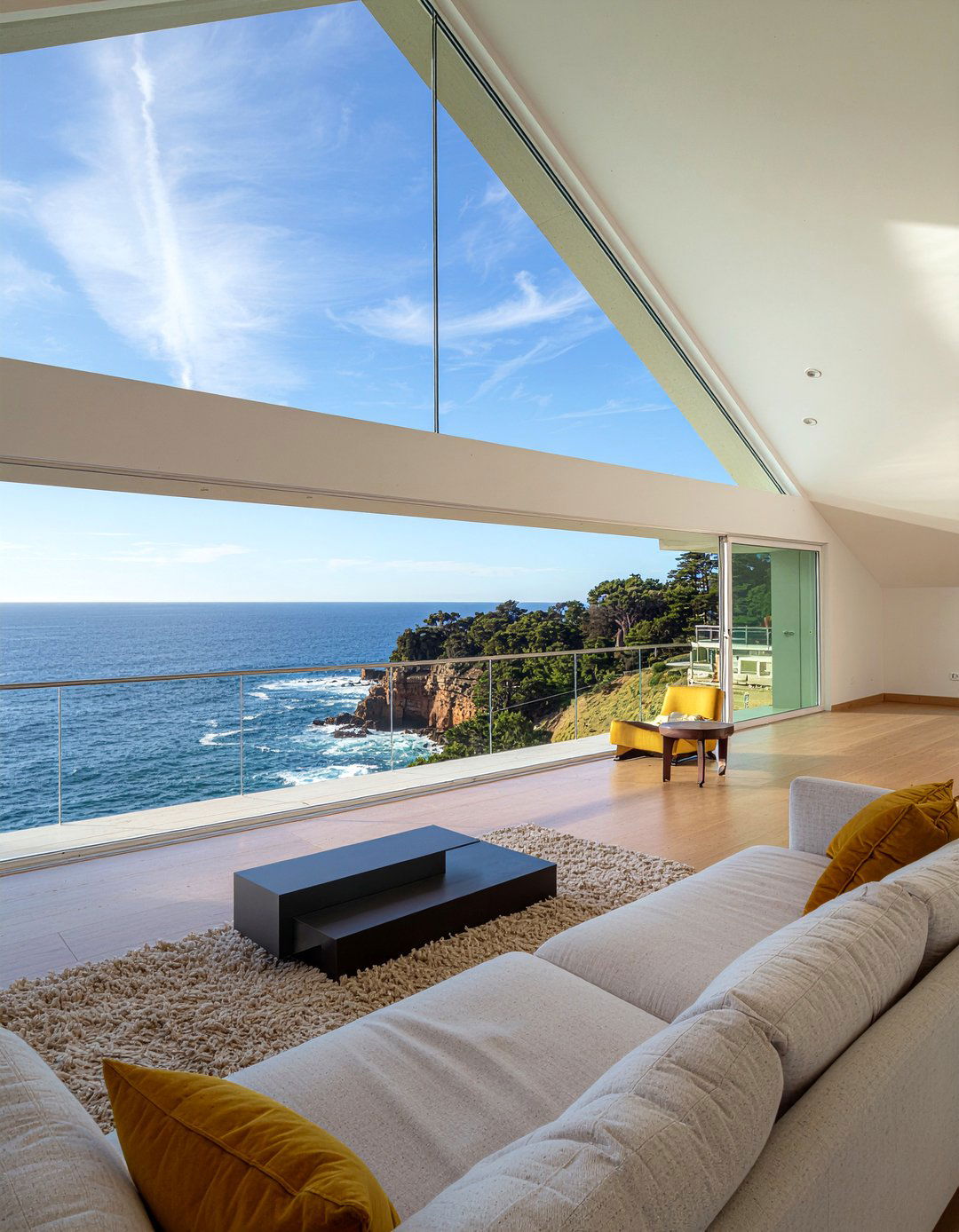 Glass wall attic living room - 30 sloped ceiling living room ideas