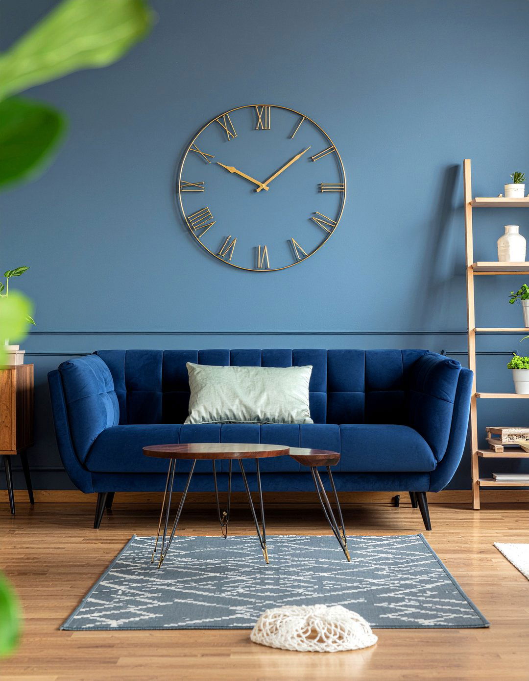 Gold clock on navy blue wall - 30 navy and gold living room ideas