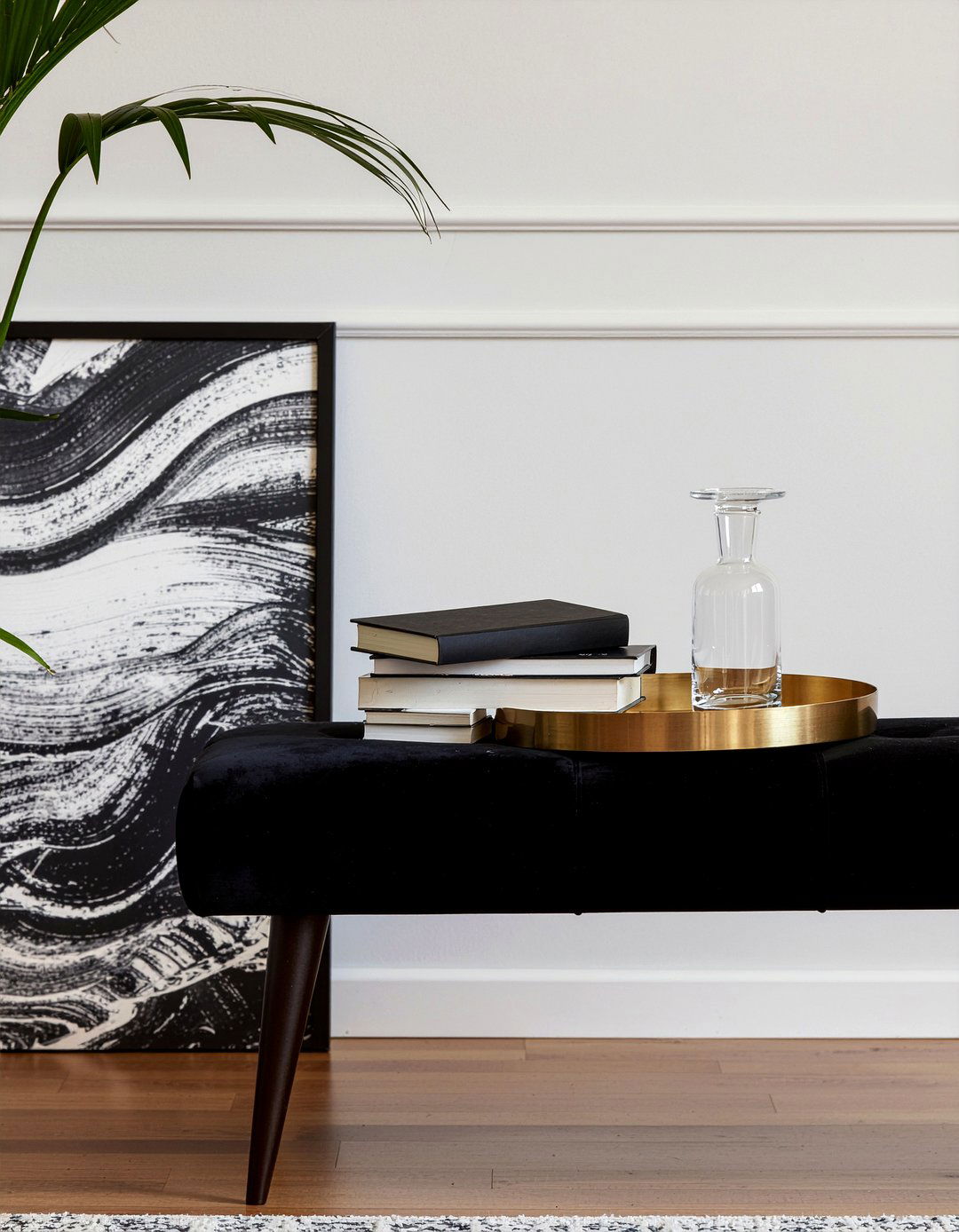 Gold metal tray on black ottoman - 30 living room tray ottoman ideas