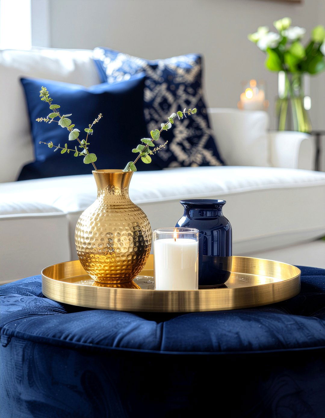Gold tray on navy storage ottoman - 30 navy and gold living room ideas