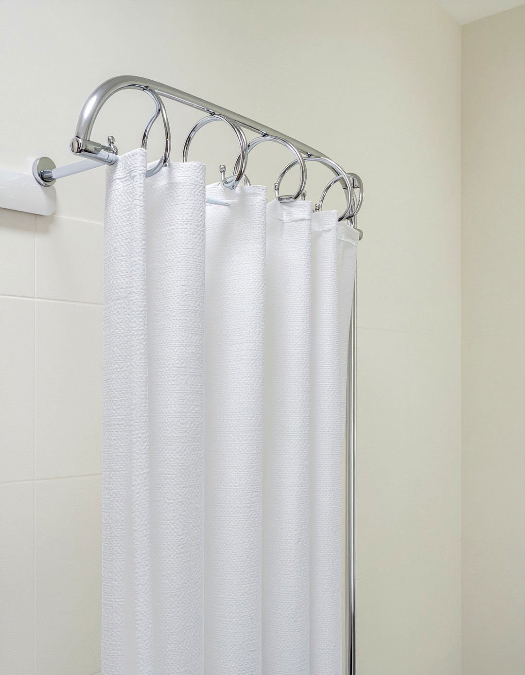 Install curved shower rod - 30 low cost bathroom makeover ideas