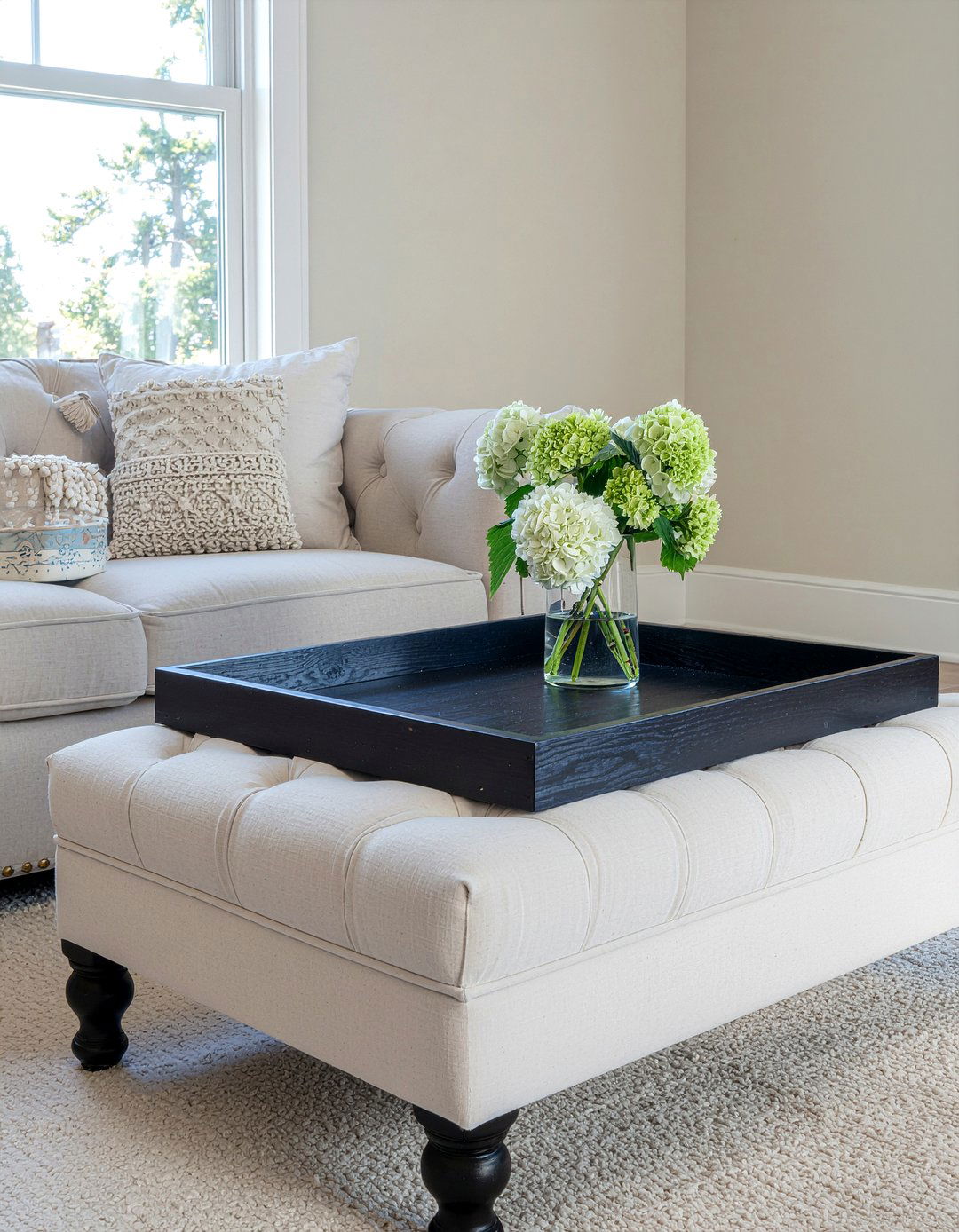 Large square tray on tufted ottoman - 30 living room tray ottoman ideas