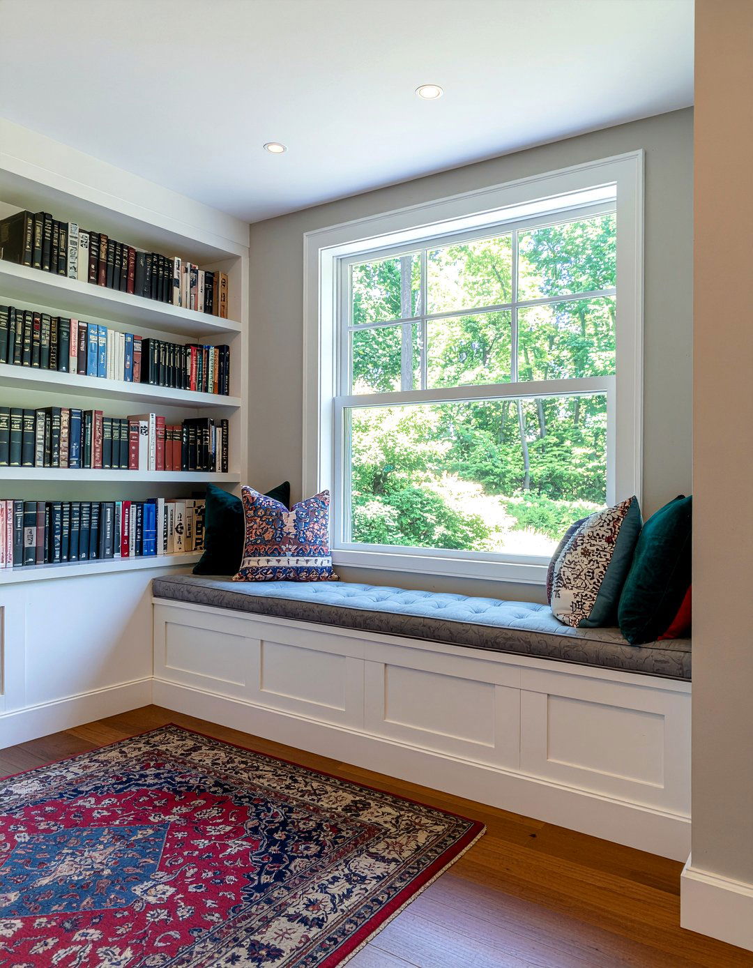 Living room with bookshelves and window seat - 30 oddly shaped living room ideas