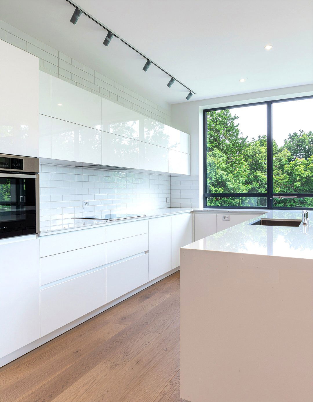 Minimalist All White Kitchen - 30 panel-ready refrigerator kitchen ideas