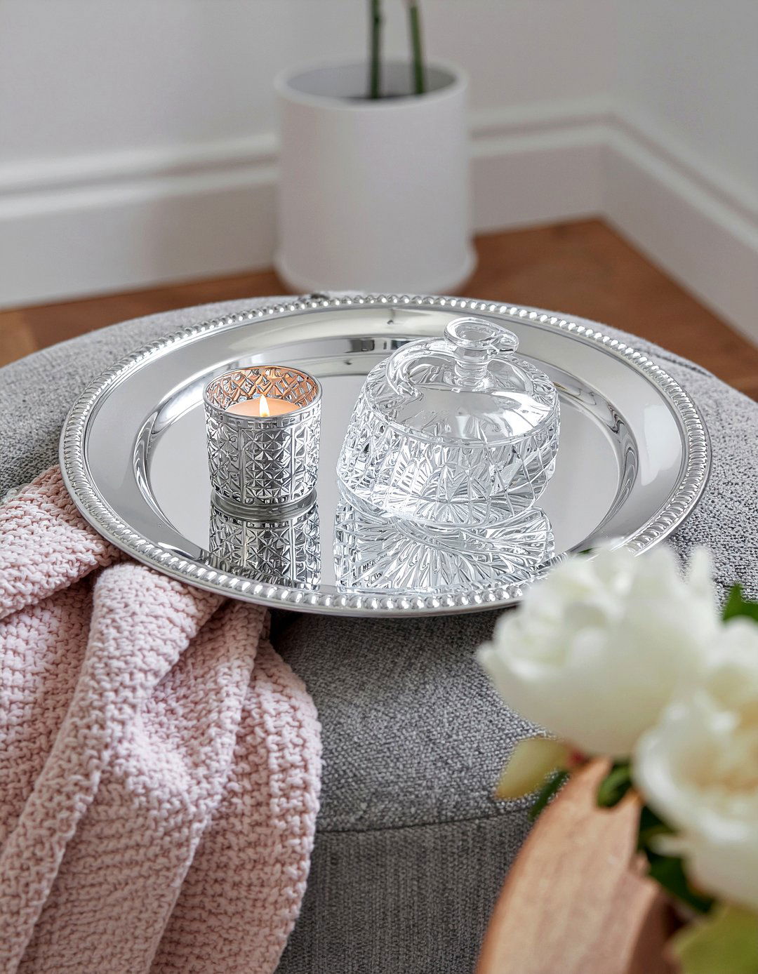 Mirrored tray on gray ottoman - 30 living room tray ottoman ideas