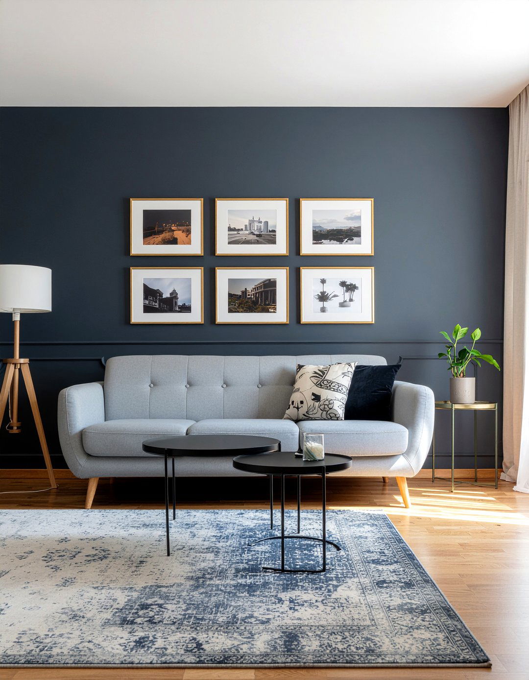 Navy accent wall with gold frames - 30 navy and gold living room ideas