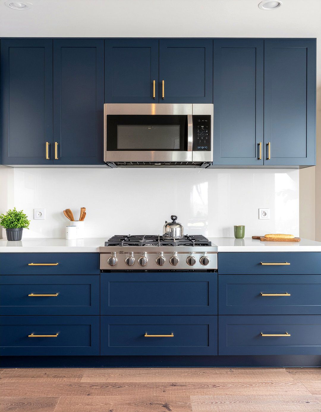 Navy blue kitchen cabinets with microwave over range - 30 over-the-range microwave kitchen ideas