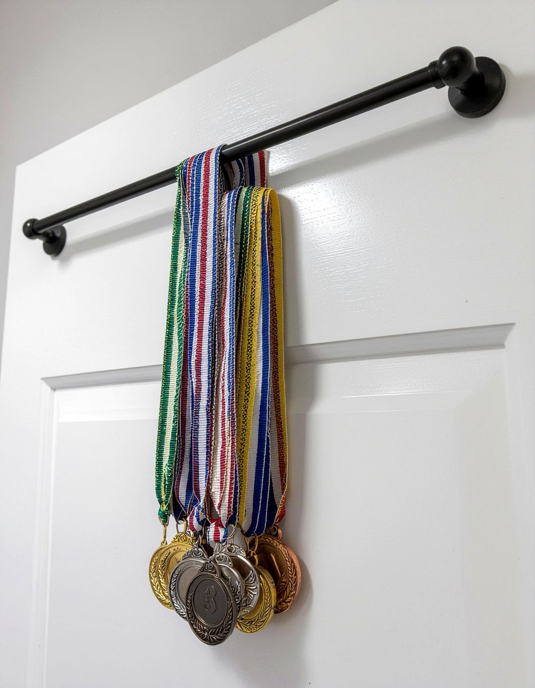 Over the door medal hanger - 30 bedroom award display ideas