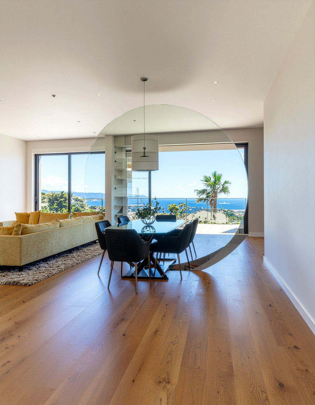 Oversized Round Mirror In Open Concept Dining - 30 round mirror dining room ideas