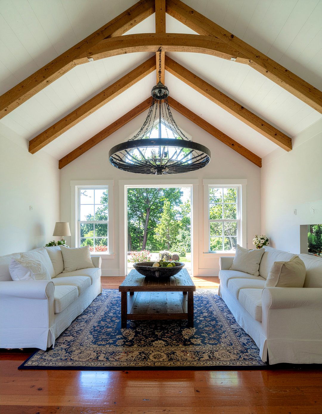 Oversized wagon wheel chandelier - 30 living room cathedral ceiling ideas
