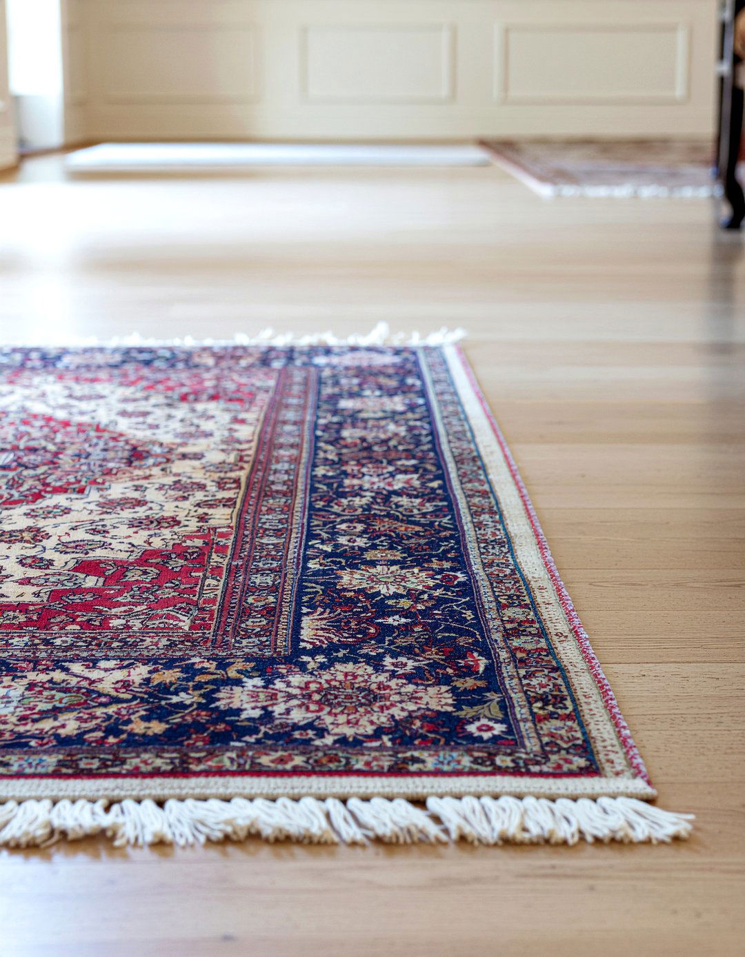 Persian rug on neutral rug - 30 living room rug layering ideas