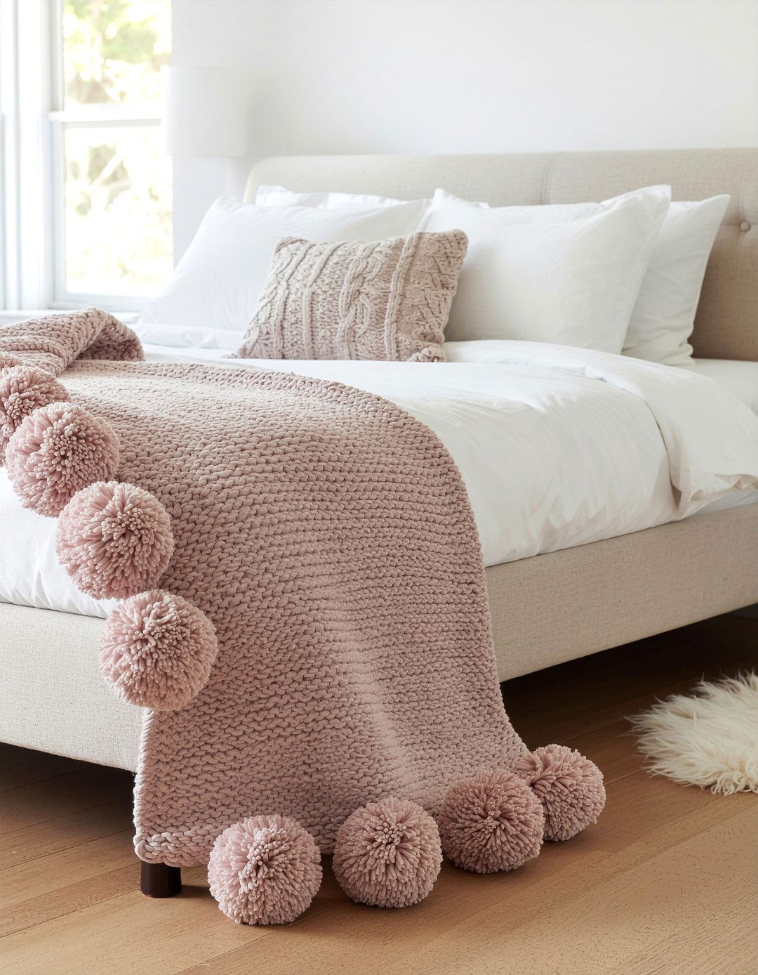 Pom pom throw blanket - 30 DIY bedroom decor ideas