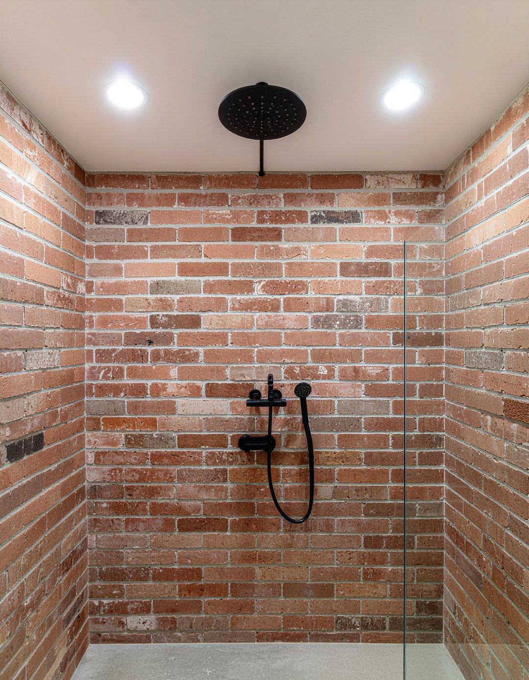 Salvaged brick shower - 30 reclaimed material bathroom ideas