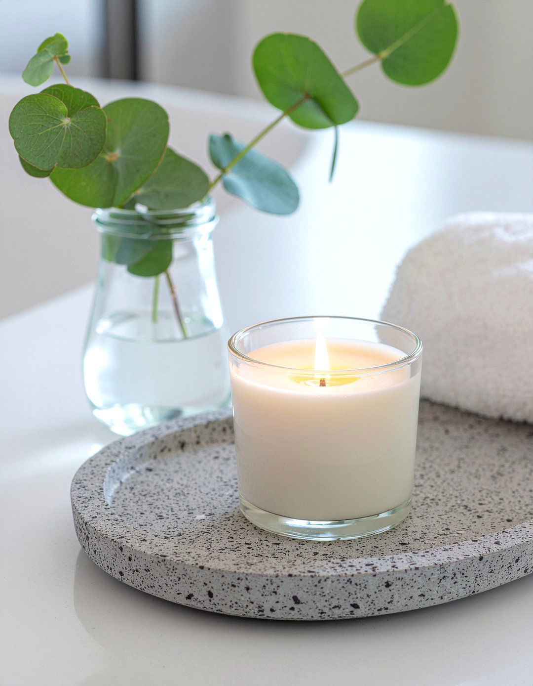 Scented candle on stone tray - 30 bathroom layering ideas