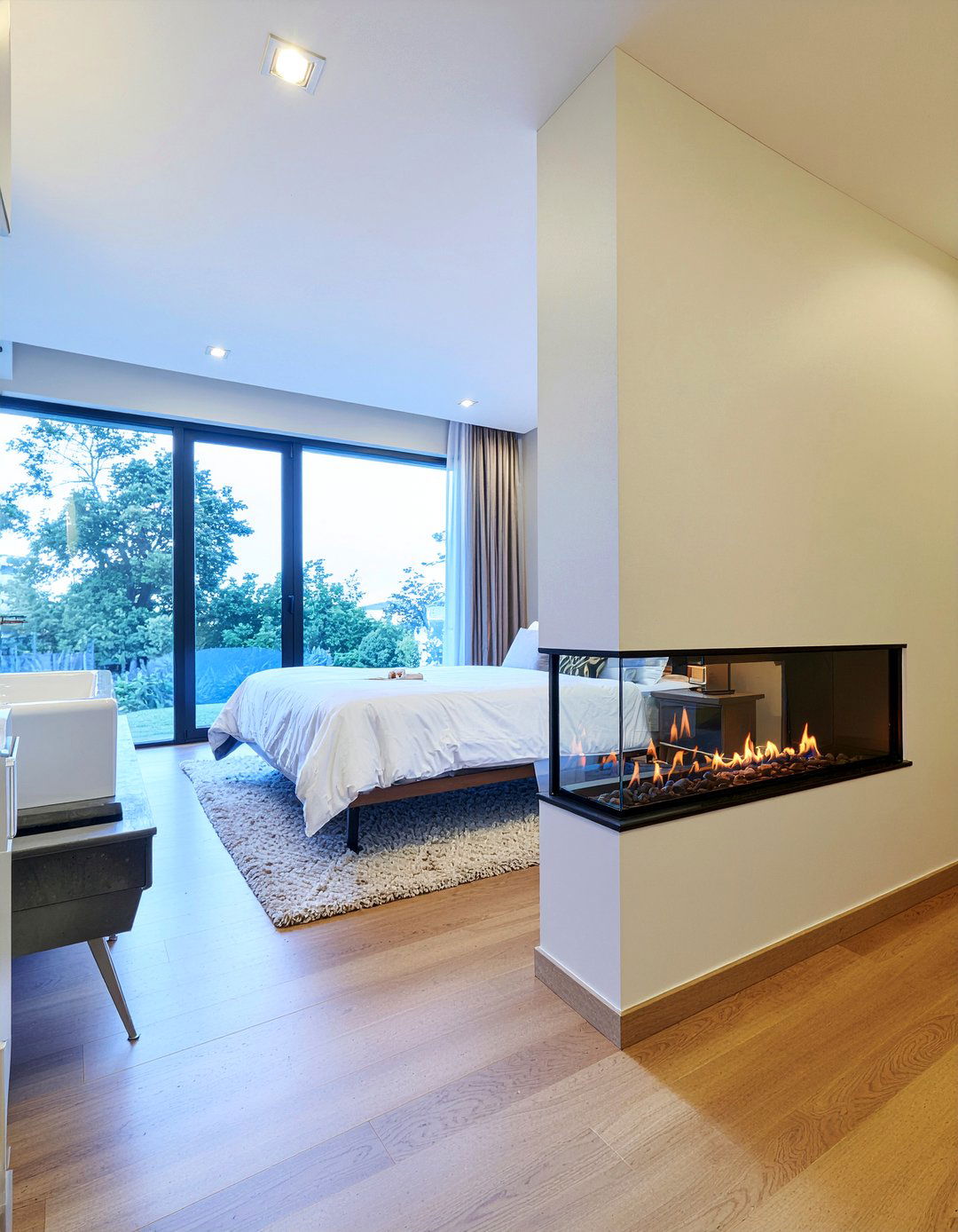 See through fireplace master suite - 30 bathroom fireplace ideas