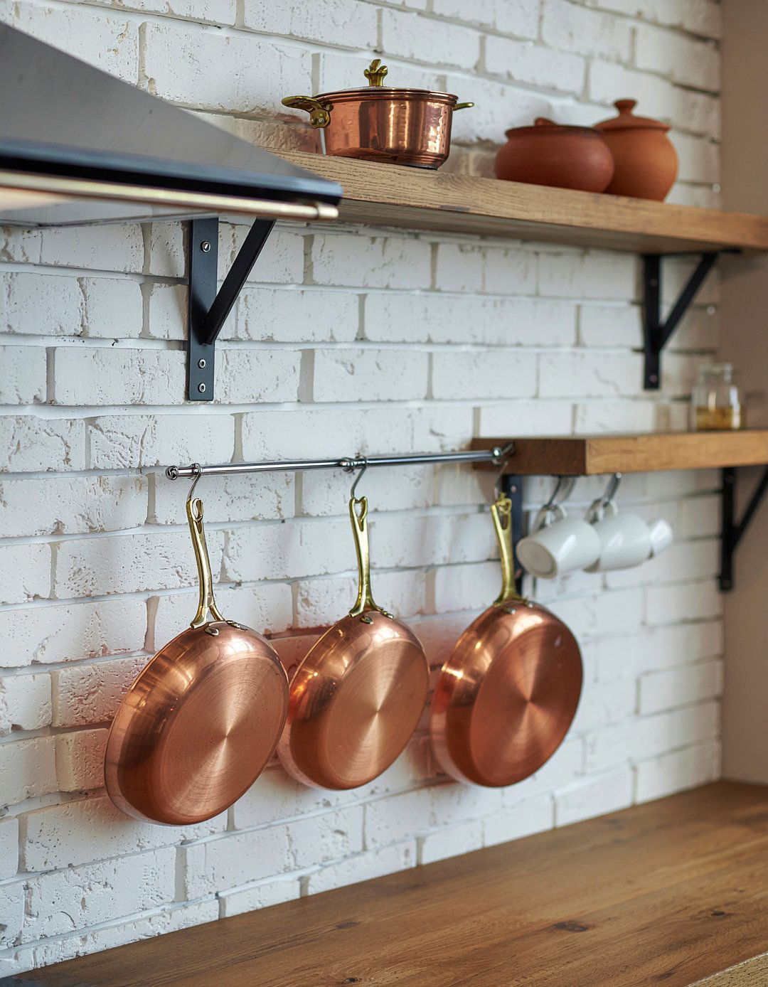 Wall mounted pot rack - 30 kitchen layering ideas